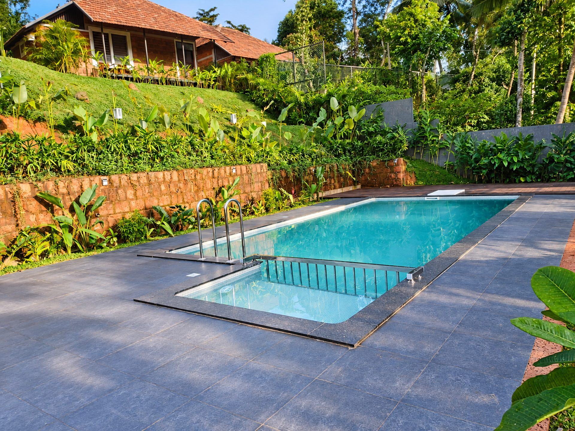 Garden swimming pool in Wayanad by Moothedan, contact us for swimming pool construction in Kerala