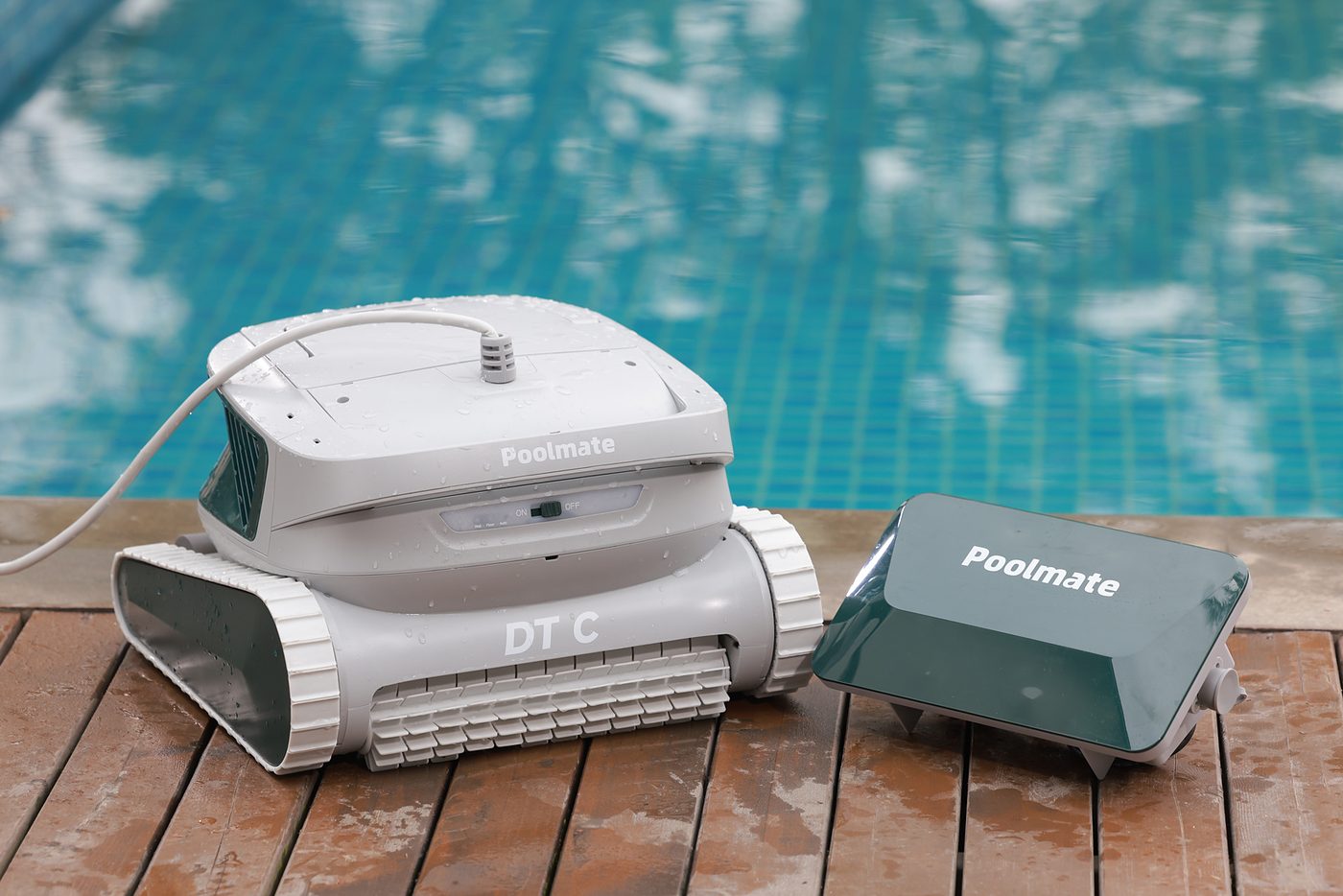 Poolmate DT C robotic pool cleaner on a pool deck