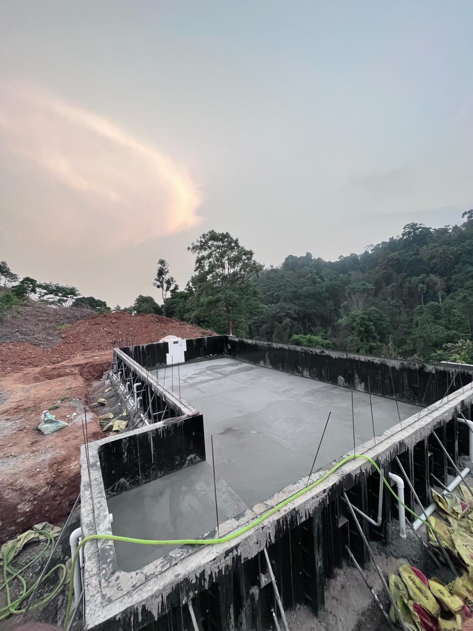 Concrete pour, M30 waterproofed concrete filling the formed pool shell in a single continuous pour